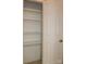 Spacious walk-in pantry with multiple shelves for organized storage and a white door at 194 E Jay Dr # 3, Taylorsville, NC 28681