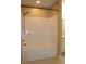 A pristine, white shower tub with a handheld shower head set against a neutral-toned wall at 194 E Jay Dr # 3, Taylorsville, NC 28681