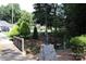 A serene yard with a creek, bridge, and a bench for relaxation at 194 E Jay Dr # 3, Taylorsville, NC 28681