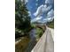 Scenic walking bridge view surrounded by greenery and a flowing stream at 405 Wakefield Dr # B, Charlotte, NC 28209