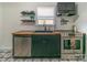 Modern kitchen featuring stainless steel appliances, butcher block countertops, and dark cabinets at 405 Wakefield Dr # B, Charlotte, NC 28209
