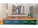 Kitchen view highlighting butcher block countertop and green cabinets with updated fixtures and design at 405 Wakefield Dr # B, Charlotte, NC 28209