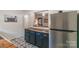 Updated kitchen with butcher block countertop, black cabinets, stainless steel fridge, and modern hardware at 405 Wakefield Dr # B, Charlotte, NC 28209