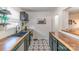 Updated kitchen featuring black cabinets, stainless steel appliances, and butcher block countertops at 405 Wakefield Dr # B, Charlotte, NC 28209