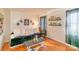 Bright living room with hardwood floors, a comfy couch, and decorative wall accents at 405 Wakefield Dr # B, Charlotte, NC 28209