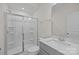 Clean bathroom featuring a glass-enclosed shower and functional sink at 5019 Layman Dr # 26, Charlotte, NC 28226
