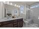 Elegant bathroom features a marble shower, dual sinks, and a spacious vanity area at 5019 Layman Dr # 26, Charlotte, NC 28226