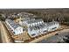 New townhouse construction showcases modern design with white exteriors and gray roofs in a planned community at 5027 Layman Dr # 24, Charlotte, NC 28226