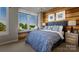 Serene bedroom featuring a cozy window seat, wood accent wall, and designer bedding at 5027 Layman Dr # 24, Charlotte, NC 28226