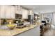 Well-appointed kitchen with a large island, stainless appliances, and a seamless connection to the dining area at 5027 Layman Dr # 24, Charlotte, NC 28226