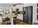 Stylish kitchen showcases stainless steel appliances, a spacious island, and convenient breakfast bar seating at 5027 Layman Dr # 24, Charlotte, NC 28226