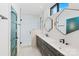Sleek bathroom with double sinks, stylish vanities, and glass-enclosed shower, providing a spa-like atmosphere at 819 E 36Th St, Charlotte, NC 28205