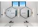 Modern bathroom featuring double vanity, sleek mirrors, and contemporary fixtures, offering a luxurious experience at 819 E 36Th St, Charlotte, NC 28205