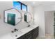 Contemporary bathroom with double vanities, unique lighting, and modern fixtures, creating a stylish and functional space at 819 E 36Th St, Charlotte, NC 28205