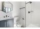 Modern bathroom with a walk-in shower, stylish vanity, and matte black fixtures at 819 E 36Th St, Charlotte, NC 28205