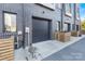 Contemporary townhome exterior with brick facade and private garage access, providing modern appeal and convenience at 819 E 36Th St, Charlotte, NC 28205