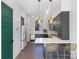 Modern kitchen with gray cabinets, white countertops, stainless steel appliances, and hardwood floors at 819 E 36Th St, Charlotte, NC 28205