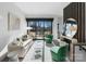 Bright living room with balcony access, hardwood floors, and modern furnishings at 819 E 36Th St, Charlotte, NC 28205