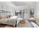 Bright bedroom featuring a large window, cozy bed, and modern decor at 819 E 36Th St, Charlotte, NC 28205