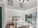 Bright bedroom featuring a large window, cozy bed, and vaulted ceilings at 819 E 36Th St, Charlotte, NC 28205