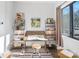 Bright office space with work desk, stool, rugs, and lots of natural light at 819 E 36Th St, Charlotte, NC 28205