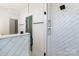 Modern shower with stylish tiling and glass enclosure, providing a luxurious and functional bathing experience at 819 E 36Th St, Charlotte, NC 28205