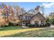 Brick house with a large front yard and walkway at 8217 Curico Ln, Charlotte, NC 28227