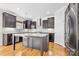 Modern kitchen with dark cabinets and an island at 8217 Curico Ln, Charlotte, NC 28227