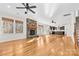 Open living room with hardwood floors and fireplace at 8217 Curico Ln, Charlotte, NC 28227