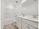 Bathroom features double sink vanity, a large mirror, and a tub with shower at 1063 Bull Dog Ln, Wingate, NC 28174