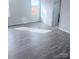 Bedroom featuring wood-look floors, natural light, and a doorway to an ensuite bathroom at 1063 Bull Dog Ln, Wingate, NC 28174