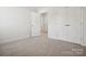 Bedroom features carpet flooring and large closet space at 1063 Bull Dog Ln, Wingate, NC 28174