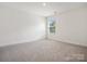 Bedroom with carpet and a single window providing natural light at 1063 Bull Dog Ln, Wingate, NC 28174