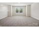Bedroom with carpet, white walls, and natural light from windows at 1063 Bull Dog Ln, Wingate, NC 28174