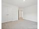 Bedroom features carpet flooring and a double door closet at 1063 Bull Dog Ln, Wingate, NC 28174