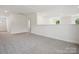 Bright bonus room features neutral walls, carpet and access to other spaces at 1063 Bull Dog Ln, Wingate, NC 28174