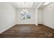 Open-concept dining room boasts hardwood floors and abundant natural light at 1063 Bull Dog Ln, Wingate, NC 28174