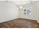 Open-concept dining room boasts hardwood floors, coffered ceiling, and abundant natural light at 1063 Bull Dog Ln, Wingate, NC 28174
