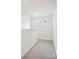 Upstairs hallway featuring carpeted floors and bright windows at 1063 Bull Dog Ln, Wingate, NC 28174