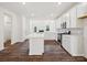 Modern kitchen featuring white cabinets, an island, stainless steel appliances, and hardwood floors at 1063 Bull Dog Ln, Wingate, NC 28174