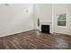 Living room with lots of windows for natural light and a modern fireplace at 1063 Bull Dog Ln, Wingate, NC 28174