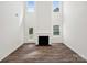 Living room with lots of windows for natural light and a cozy fireplace at 1063 Bull Dog Ln, Wingate, NC 28174
