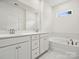 Main bathroom with double sink vanity and a soaking tub at 1063 Bull Dog Ln, Wingate, NC 28174