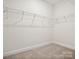 Walk-in closet with wire shelving and carpeted floor at 1063 Bull Dog Ln, Wingate, NC 28174