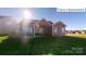 House exterior showcasing a patio and grilling station at 2015 Canvasback Way, Indian Trail, NC 28079