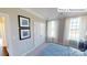 Bedroom with double door closet and large windows with natural light at 2015 Canvasback Way, Indian Trail, NC 28079