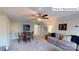 Bonus room with sectional sofa, dining table, and access to hallway at 2015 Canvasback Way, Indian Trail, NC 28079