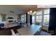 Bright dining room with large windows and a view of the backyard at 2015 Canvasback Way, Indian Trail, NC 28079