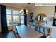 Formal dining room featuring a spacious table, chairs, and large windows at 2015 Canvasback Way, Indian Trail, NC 28079