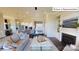 Open living room with comfortable seating, a fireplace and access to backyard at 2015 Canvasback Way, Indian Trail, NC 28079